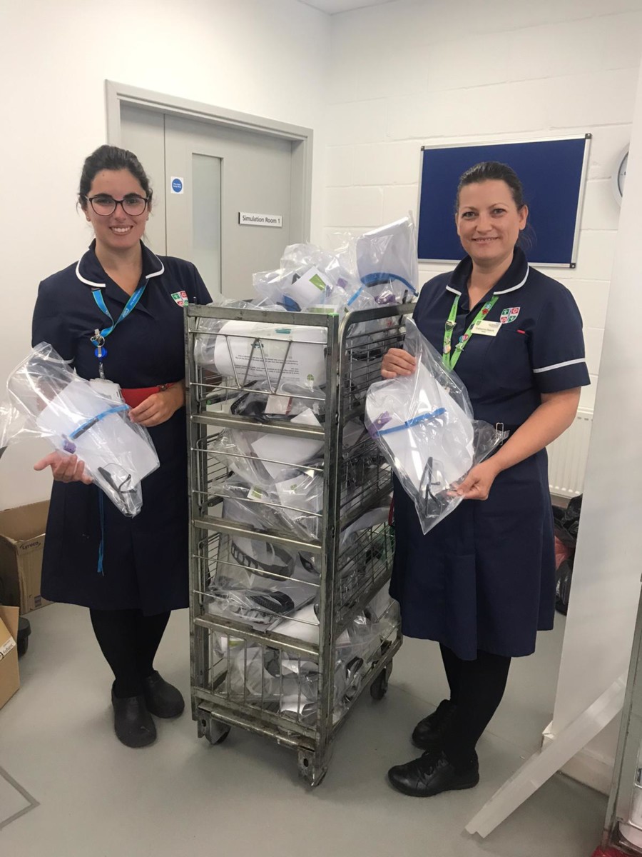 Nurses receiving donation from local school