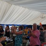 Attendees clapping at the Bingo Bonanza