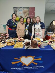 Staff at a cake stand