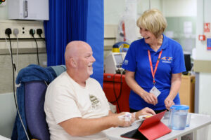 Volunteer and patient in bed