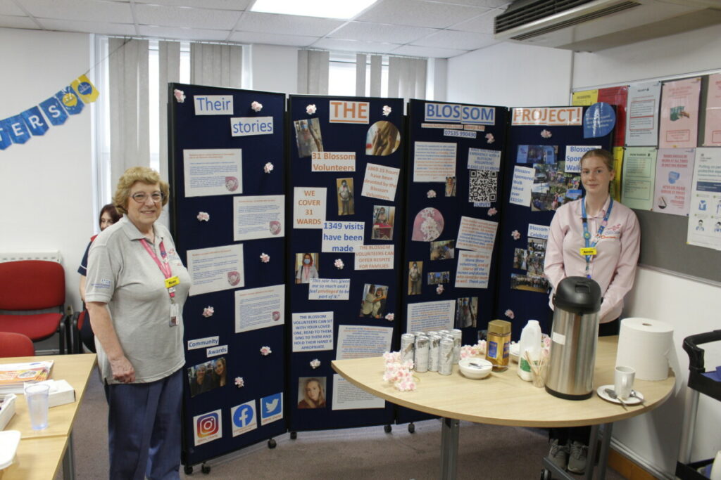 Rose and Annie with the Blossom Project display