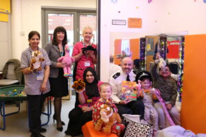 Sergeant Phil Boyd with staff and young patients