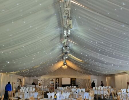 A marquee with tables and chairs