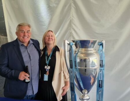 Attendees with a trophy