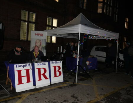 Staff from Hospital Radio Bedford outside the hospital under a marquee