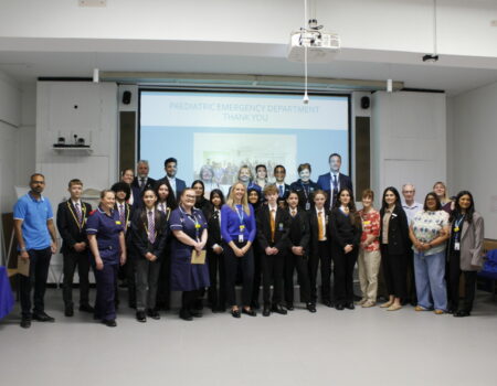 Group photo of attendees at ED sky panel ceremony