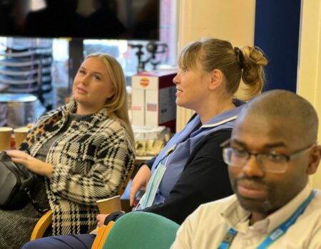 Staff sitting talking at apprenticeship event