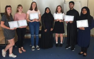 Young volunteers receiving certificates