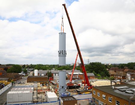 Chimney flue being delivered via crane