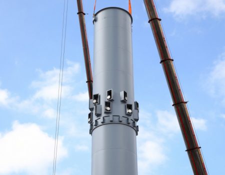 Close up of top of chimney flue being erected into place