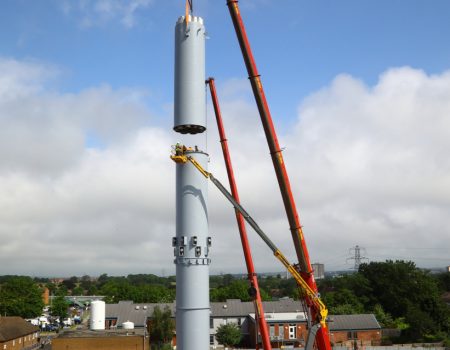 Final part of chimney flue being put into place