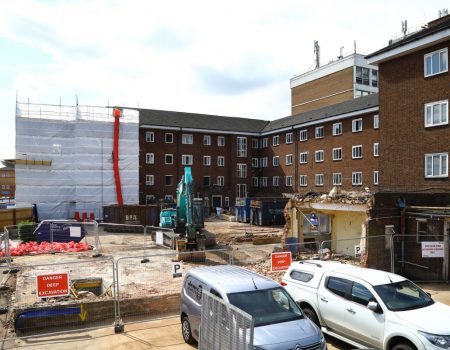 Building site with crane and part of the building demolished