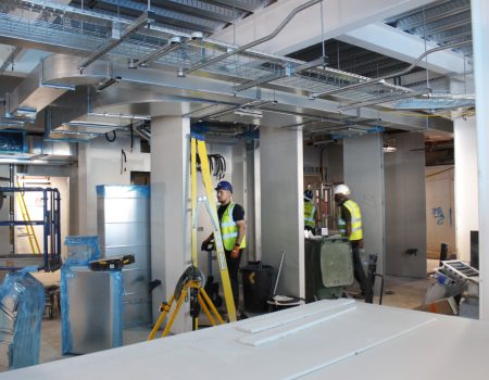 Interior Emergency Department upgrades with men next to ladder