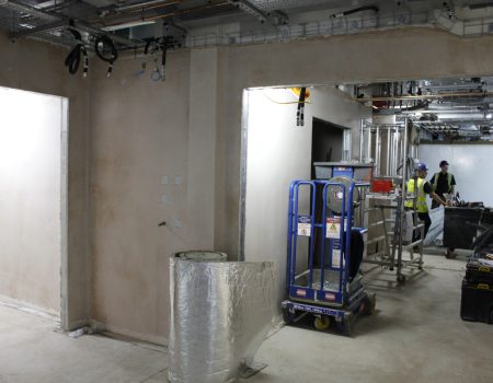 Interior of Emergency Department upgrades with walls and men in background
