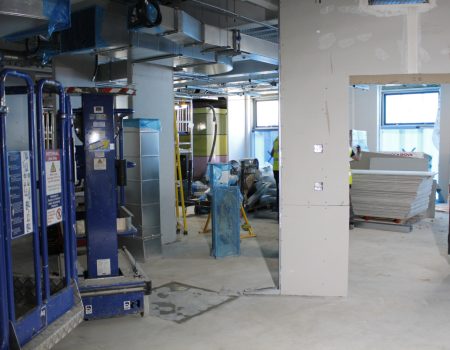 Interior of emergency department upgrades with white walls and blue equipment in background