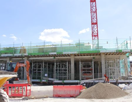 Redevelopment upgrades with crane in background with green fencing