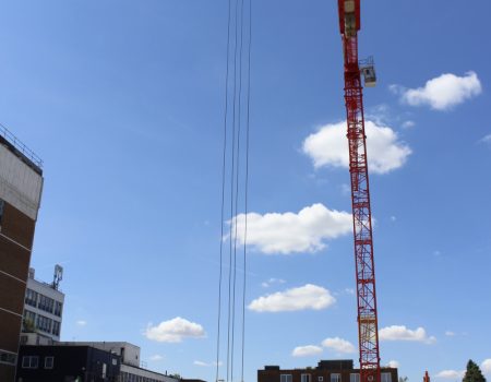 Tower crane positioned on construction site for acute services block and new ward block