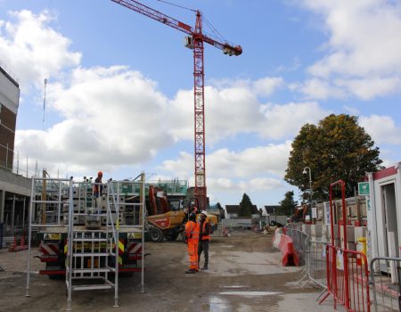 Tower crane with construction work on New Ward Block