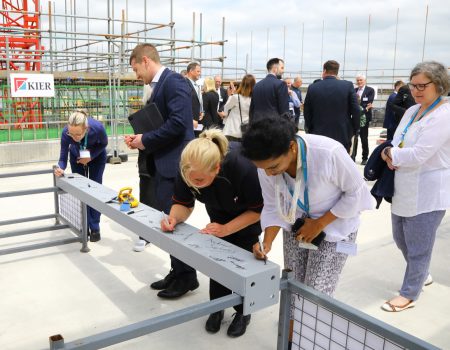 Colleagues signing steel