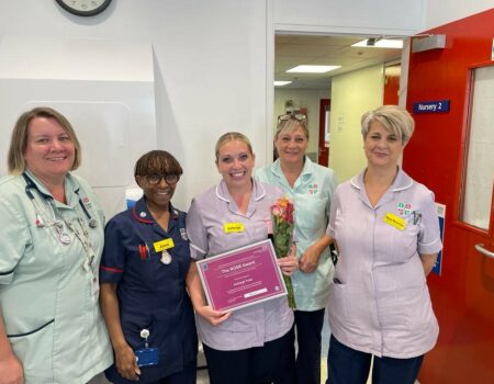 Ashleigh Todd with her ROSE runner-up certificate and colleagues