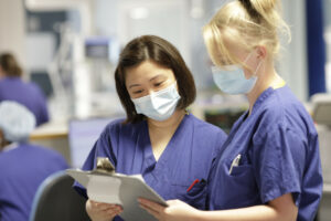 ITU staff looking at clipboard