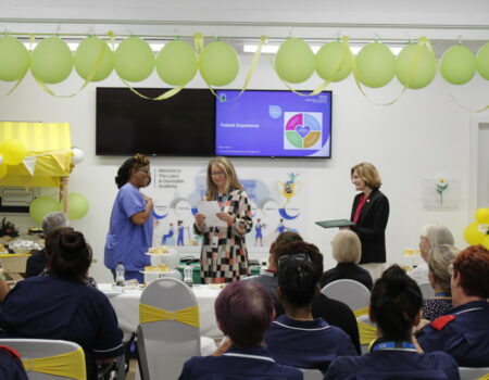 Natalie receives her DAISY award from Liz and Deb