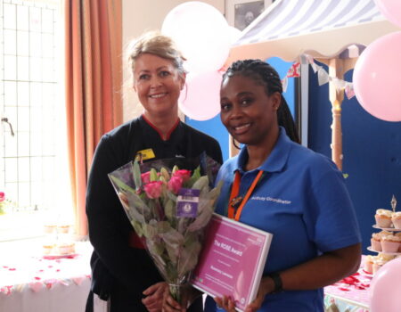 Rosemary receiving the ROSE runner up from Liz