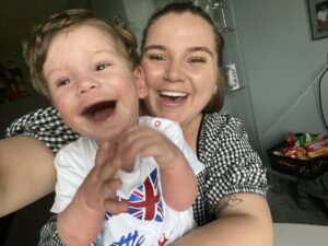 Tommy and mother Lauren laughing as they take a selfie