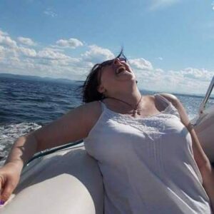 Tracey laughing while in a boat