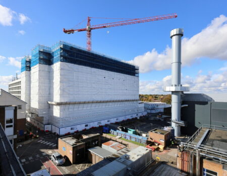 Acute services exterior showing one crane and scaffolding - October 2023