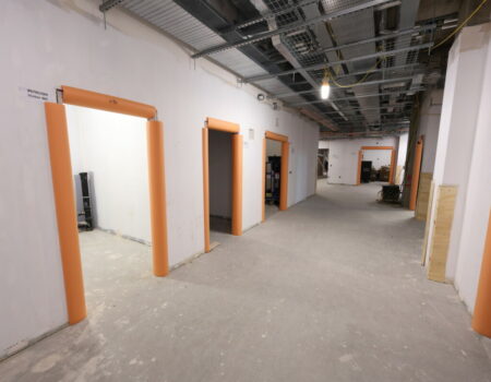 Acute services interior showing a corridor under construction - October 2023