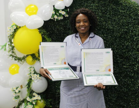 Cindy Dutiro with her two DAISY certificates