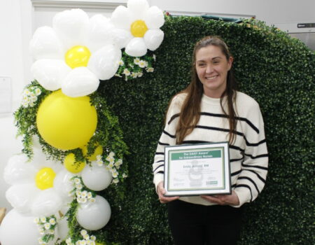 Emily Arnold with her DAISY certificate