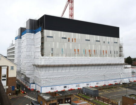 Acute Services block scaffolding lowered to show completed areas - March 2024