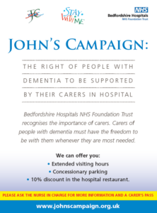 John's campaign poster saying to ask the nurse in charge for more information and to receive a carer's pass