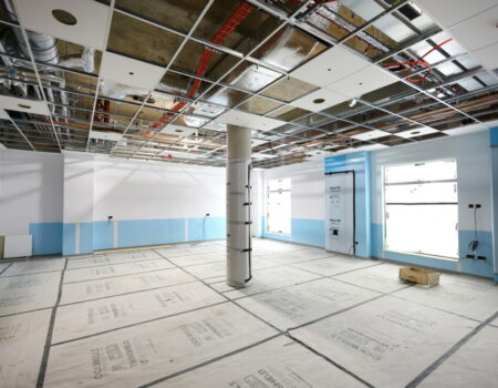 Large room interior with ceiling being added - June 2024