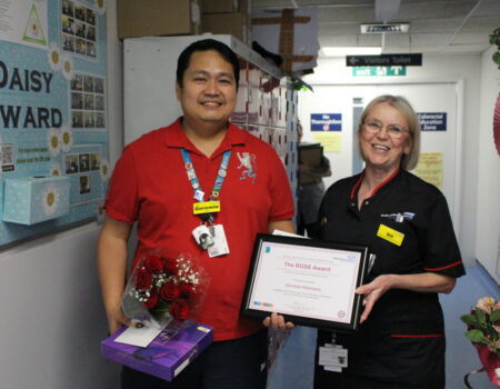 Geremie receiving his ROSE winner certificate
