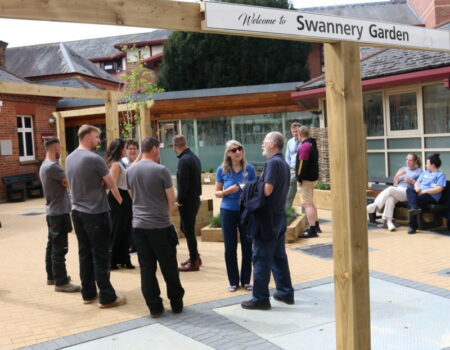 people talking in Swannery Garden