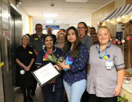 Neetu with her ROSE award and colleagues