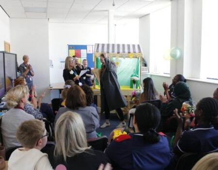 Bobbie receiving her second award while being applauded