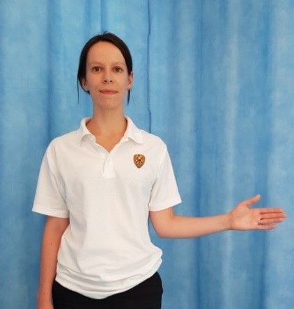 Person with their arm bent at elbow, hand pointing out to the side with palm facing forward