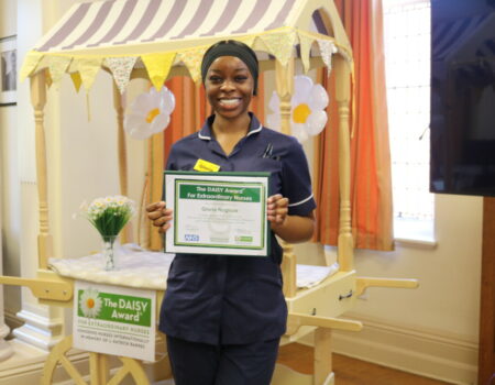 Gloria with her DAISY certificate