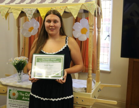 Hollie with her DAISY certificate