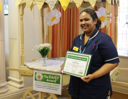 Magi with her DAISY certificate