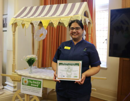 Sara Atthews with her DAISY certificate