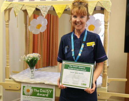 Sarah-Jane with her DAISY certificate